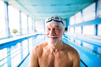 Elderly man on the swimming pool