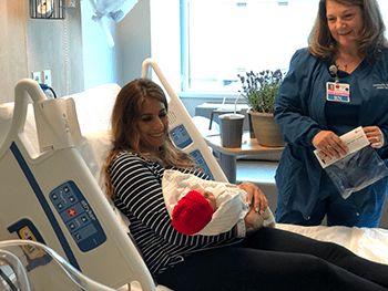 Baby with mother and nurse